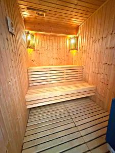a wooden sauna with two benches in a room at Villa Anastasia Sandy Beach Villas - Heated Private Overflow Pool - Hot Tub - Games Room - Private Beach Area in Polis Chrysochous