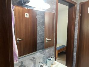 a bathroom with a sink and a mirror at The Byala Escape, Private Villa with Bar & Hot Tub in Byala