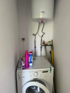 a washer and dryer in a small room at The Byala Escape, Private Villa with Bar & Hot Tub in Byala