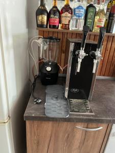 a blender sitting on top of a counter at The Byala Escape, Private Villa with Bar & Hot Tub in Byala