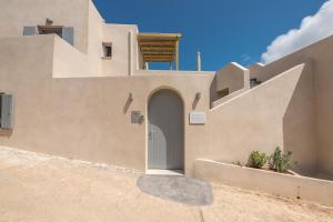 a house with a door in the side of it at Comodo Studios in Kythira +165 photos
