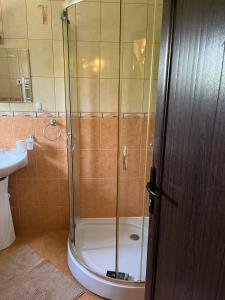 a shower with a glass door in a bathroom at The Byala Escape, Private Villa with Bar & Hot Tub in Byala
