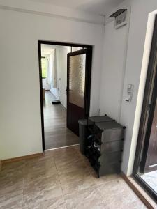 a hallway with a door leading into a room at The Byala Escape, Private Villa with Bar & Hot Tub in Byala