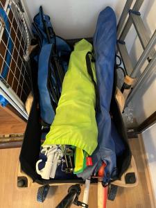 an open suitcase filled with gear on the floor at The Byala Escape, Private Villa with Bar & Hot Tub in Byala