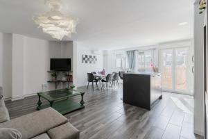 a living room with a couch and a table at Enjoy Valencia: Deluxe Apartment with Terrace in Valencia