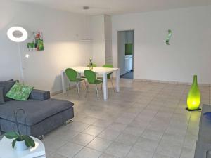 a living room with a table and a couch at Alle Vigne, 3 Stock by HolAp SA in Ascona