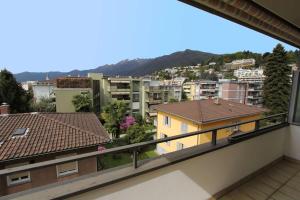 een balkon met uitzicht op de stad bij Alle Vigne, 3 Stock by HolAp SA in Ascona