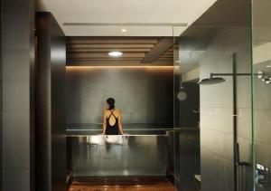 a mannequin in a black lingerie is in a bathroom at Hostal Empúries in L'Escala +37 photos