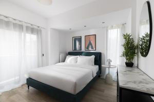 Ένα ή περισσότερα κρεβάτια σε δωμάτιο στο Superstudio Pop Art Apartments by BiNoBi!