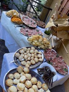 a table with many plates of food on it at Casa Bicocchi in Lanciole