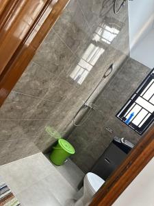an overhead view of a bathroom with a toilet and a shower at Zaya Residency in Kampala +94 photos