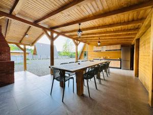 a large dining room with a long table and chairs at Cabana Twins A-Frame 1 in Sibiu