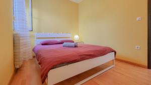 Posteľ alebo postele v izbe v ubytovaní Apartment Ticiana