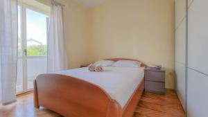 Posteľ alebo postele v izbe v ubytovaní Apartment Ticiana