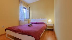 Posteľ alebo postele v izbe v ubytovaní Apartment Ticiana