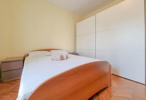 Posteľ alebo postele v izbe v ubytovaní Apartment Ticiana