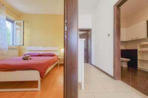 Posteľ alebo postele v izbe v ubytovaní Apartment Ticiana