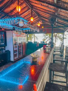 a bar with a pool in the middle of a restaurant at Ocean Lounge Bungalow in Koh Rong