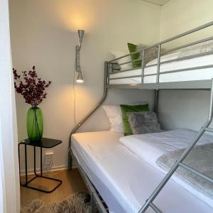 Ένα ή περισσότερα κρεβάτια σε δωμάτιο στο Villa MICHEL PremiumFerienhaus inkl Bettwäsche Handtücher