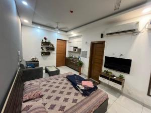 Televiisor ja/või meelelahutuskeskus majutusasutuses Supertech northeye