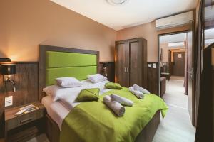 Postel nebo postele na pokoji v ubytování Park Hotel Bükfürdő