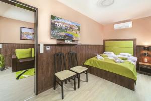 Postel nebo postele na pokoji v ubytování Park Hotel Bükfürdő