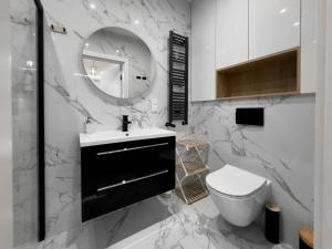 Koupelna v ubytování Bursztynowe Resort & SPA apartament 006