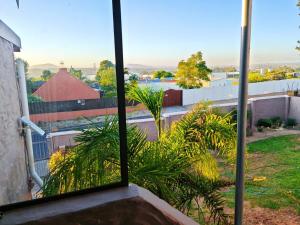 a view from a window of a building at Sunbird Studio Apartment in Brackenfell