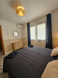 a bedroom with a large bed and a window at Marea Nova a 200 metros de la playa in Playas de Vera +30 photos