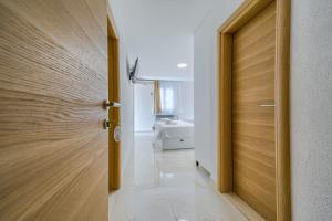 a door leading to a bathroom with a sink at Villa LeMar in Baška Voda +257 photos