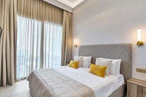 Ένα ή περισσότερα κρεβάτια σε δωμάτιο στο Olymp Luxury House