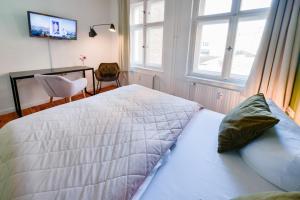 Postel nebo postele na pokoji v ubytování Old Town Hotel