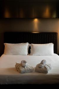 Voodi või voodid majutusasutuse Axolute Comfort Hotel Como Cantù toas