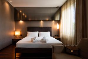 Voodi või voodid majutusasutuse Axolute Comfort Hotel Como Cantù toas