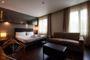 Voodi või voodid majutusasutuse Axolute Comfort Hotel Como Cantù toas