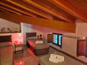 a bedroom with two beds and a couch in a room at Audrey in Montichiari