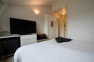 Voodi või voodid majutusasutuse Axolute Comfort Hotel Como Cantù toas