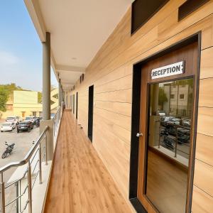 a building with a sign on the side of it at Stay Guru Hari Om Residency in Bhuj