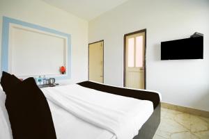 Televiisor ja/või meelelahutuskeskus majutusasutuses Super Hotel O Dumduma Near DN Regalia Mall