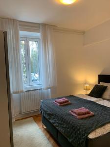 a bedroom with two beds and a window at Bonaca in Izola +32 photos