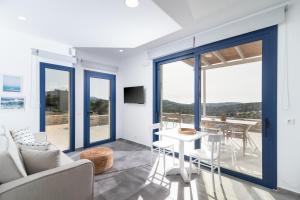 a living room with a couch and a table at Almira apartment Sivas village in Sívas