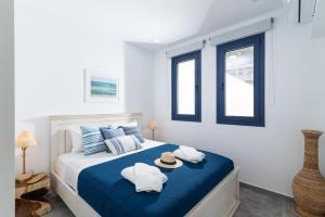 a bedroom with a bed with towels and a hat on it at Almira apartment Sivas village in Sívas