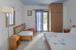 Postel nebo postele na pokoji v ubytování Sunny Hill by Estia ex Mary Sofi