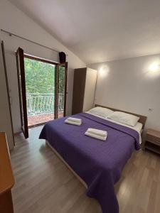 Кровать или кровати в номере Apartmani Bepo +16 фотографий