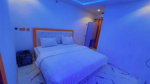 Rúm í herbergi á Samtemi Hotel