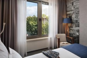 Postel nebo postele na pokoji v ubytování Hotel Colors Inn + 37 fotografií