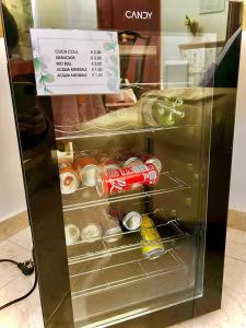a small refrigerator with food inside of it at CASA MILAN DA mariella in Palo del Colle