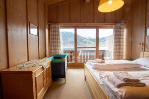 Posteľ alebo postele v izbe v ubytovaní Waterfront Apartments Zell am See - Steinbock Lodges