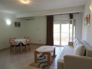 a living room with a couch and a table at Villa Njavro in Neum