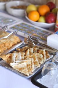 a tray of crackers and fruit on a table at Capavista Cave House Göreme in Göreme
